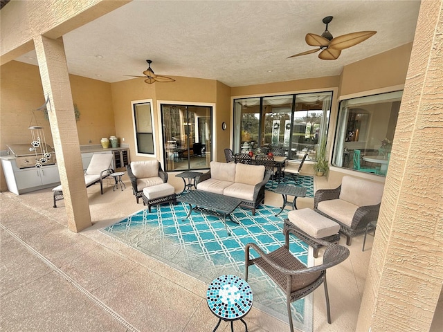 view of patio / terrace with an outdoor hangout area, a ceiling fan, and area for grilling