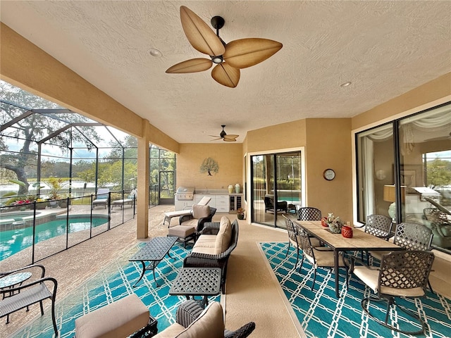 view of patio / terrace with a ceiling fan, glass enclosure, an outdoor hangout area, a pool with connected hot tub, and outdoor dining space