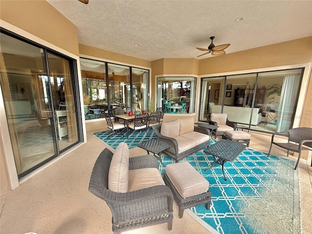 view of patio featuring an outdoor hangout area and a ceiling fan