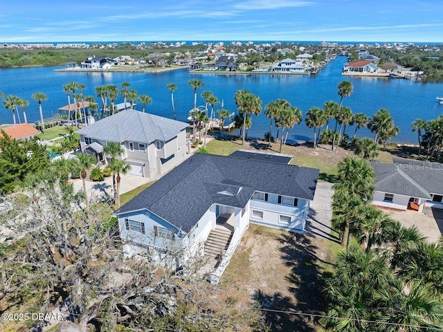 drone / aerial view with a water view