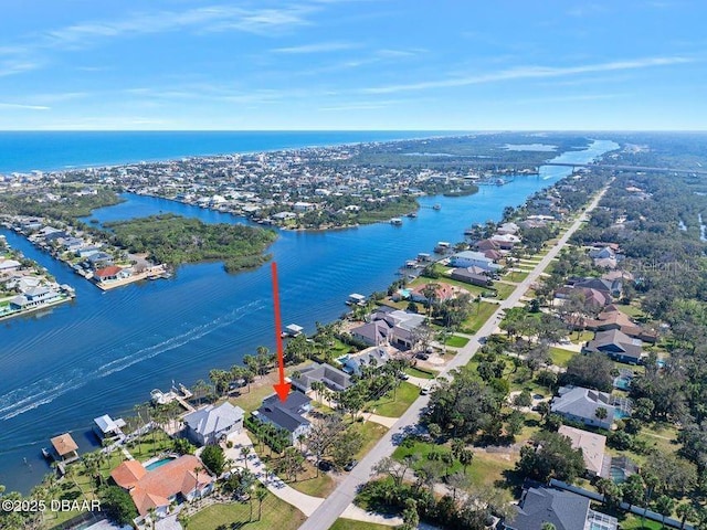 birds eye view of property with a water view