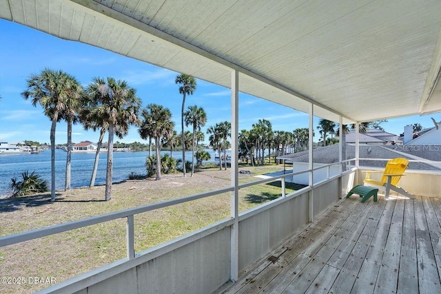 wooden deck featuring a water view