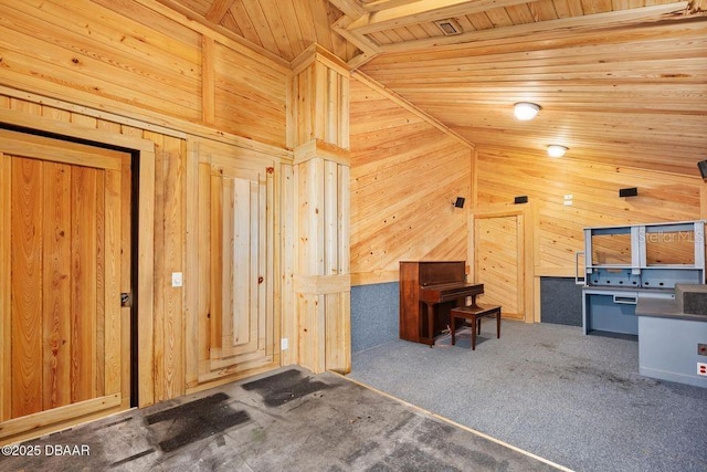 interior space with carpet, high vaulted ceiling, wood walls, and wooden ceiling