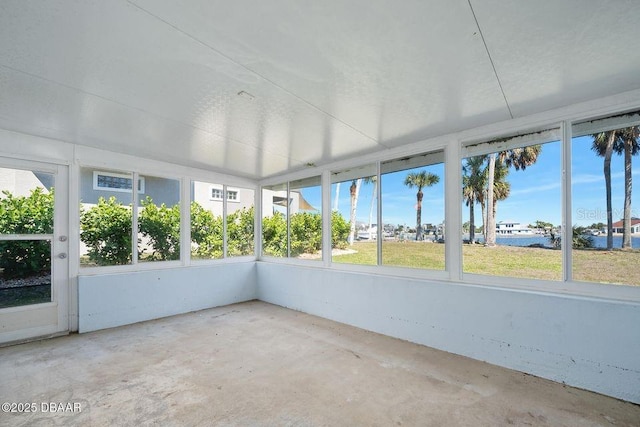 unfurnished sunroom with a wealth of natural light