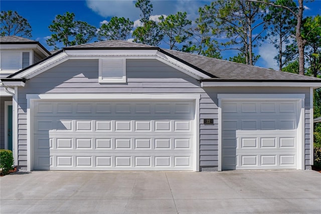 garage featuring driveway