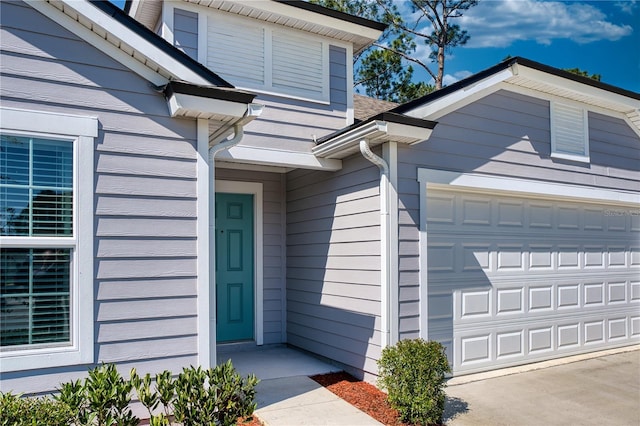 entrance to property with an attached garage