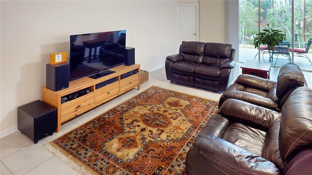 living area with light tile patterned flooring and baseboards