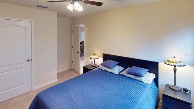 bedroom featuring carpet floors, a ceiling fan, visible vents, and baseboards