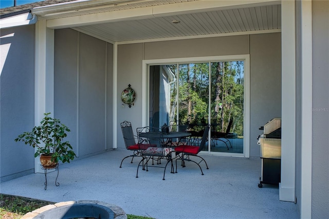 view of patio with outdoor dining area