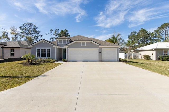 view of front of home with a front lawn, concrete driveway, fence, and an attached garage