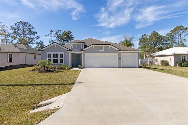 view of front facade featuring a garage, concrete driveway, and a front lawn