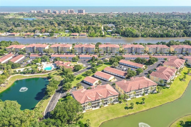 aerial view featuring a residential view and a water view