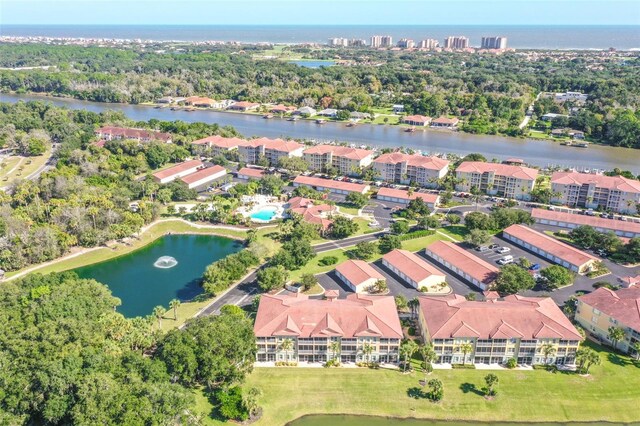 bird's eye view with a water view