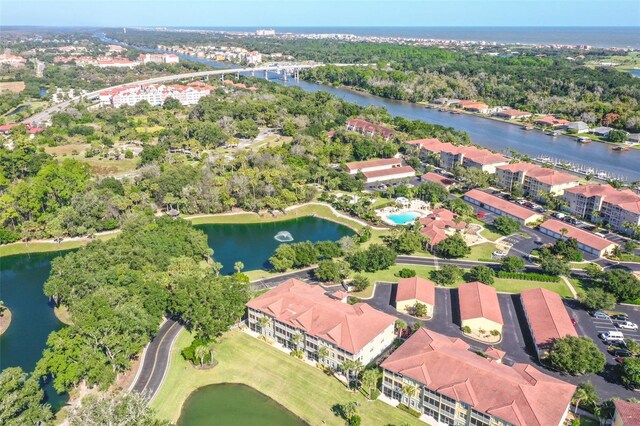 birds eye view of property featuring a water view