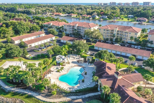 birds eye view of property with a water view