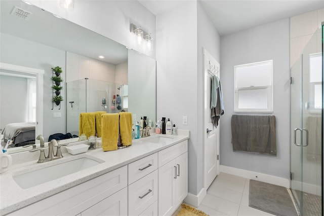 full bath featuring tile patterned flooring, connected bathroom, visible vents, and a sink