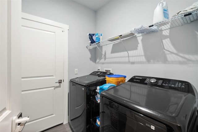 clothes washing area featuring laundry area and separate washer and dryer