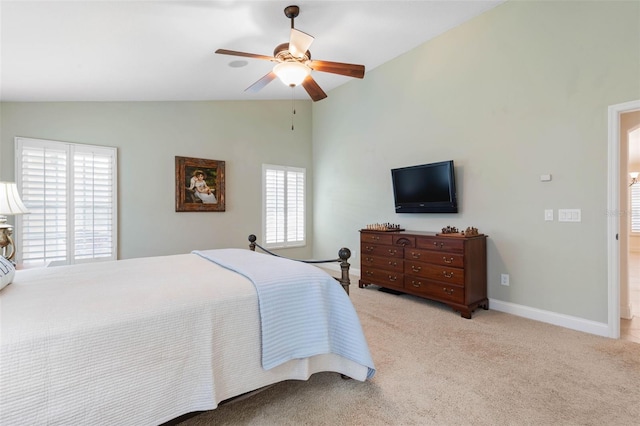 bedroom featuring lofted ceiling, carpet, baseboards, and ceiling fan