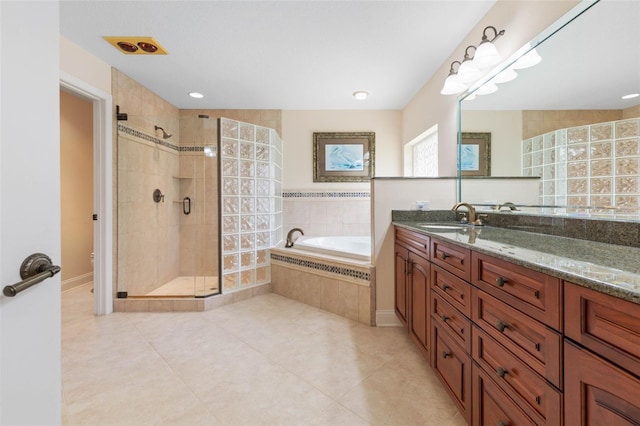 full bath featuring tile patterned flooring, toilet, vanity, a bath, and a stall shower