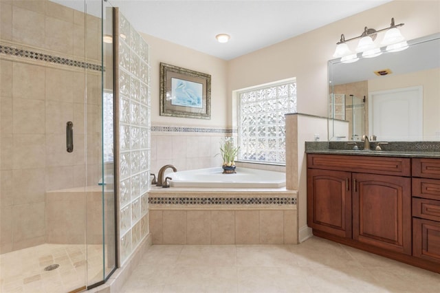 full bath with vanity, a shower stall, a bath, and tile patterned floors