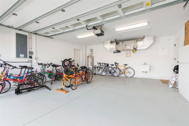 garage featuring water heater, bike storage, electric panel, and a garage door opener