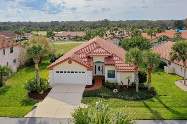 mediterranean / spanish home featuring driveway, a tiled roof, an attached garage, a front lawn, and stucco siding