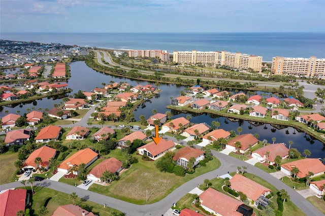 bird's eye view with a residential view and a water view