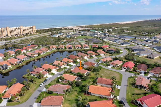 bird's eye view with a water view and a residential view