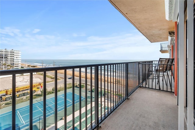 balcony featuring a water view