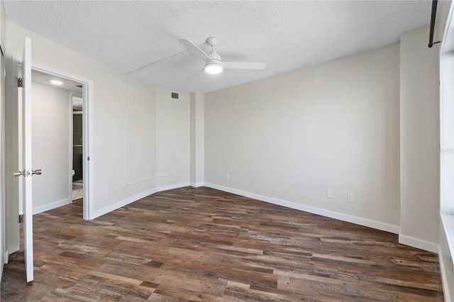 unfurnished bedroom featuring visible vents, baseboards, a ceiling fan, dark wood-style flooring, and a textured ceiling