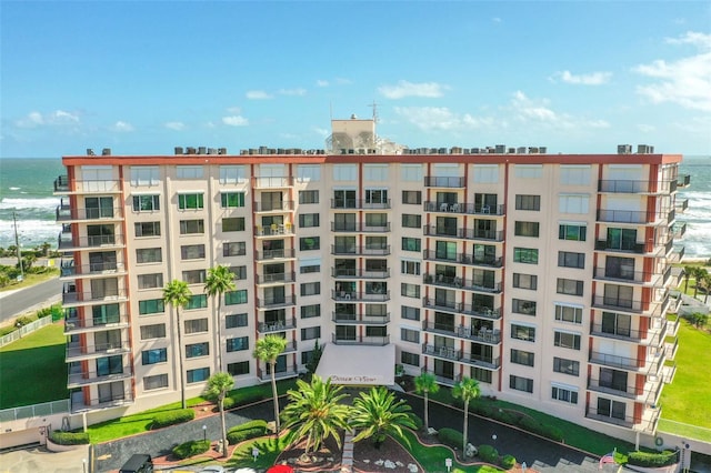 view of building exterior with a water view