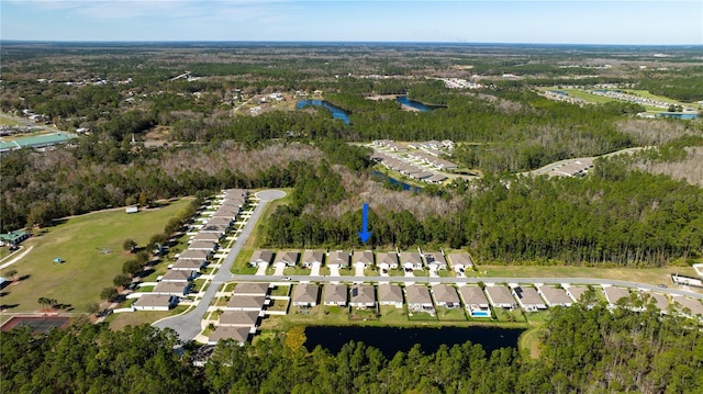 drone / aerial view featuring a residential view and a water view