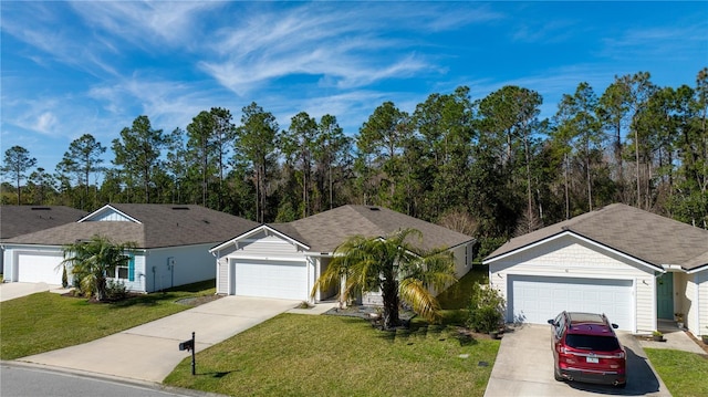 ranch-style home featuring a garage and a front yard