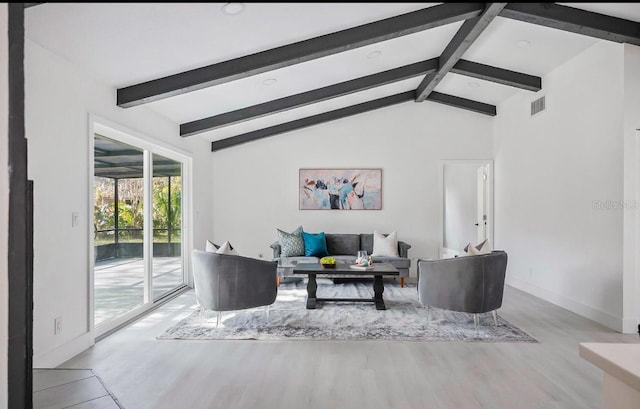 living room with vaulted ceiling with beams, baseboards, visible vents, and wood finished floors