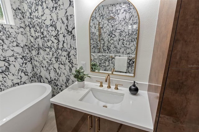 bathroom with a freestanding bath and vanity