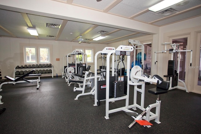 gym featuring a ceiling fan and visible vents