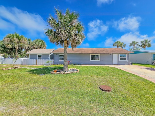 single story home featuring driveway, a front yard, and fence