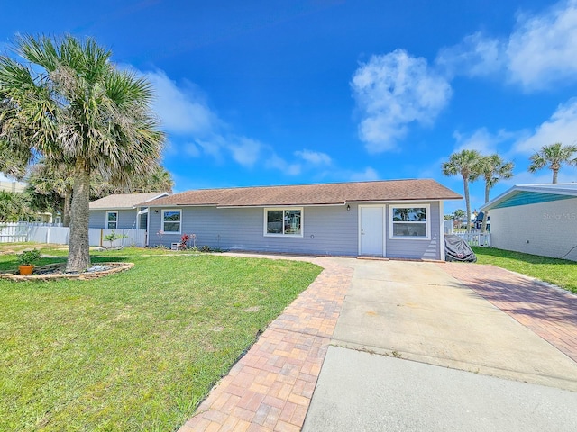 single story home with a front yard and fence