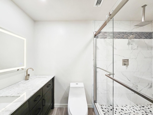 364 Palm Cir, Flagler Beach, FL 32136 - full bathroom with toilet, wood finished floors, a sink, visible vents, and a shower stall