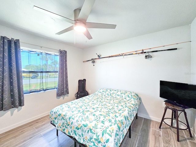364 Palm Cir, Flagler Beach, FL 32136 - bedroom featuring wood finished floors, a ceiling fan, and baseboards