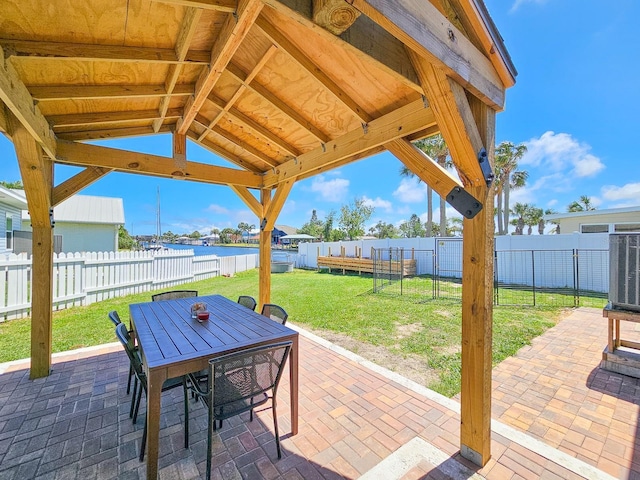 364 Palm Cir, Flagler Beach, FL 32136 - view of patio / terrace with central air condition unit, a fenced backyard, and outdoor dining space