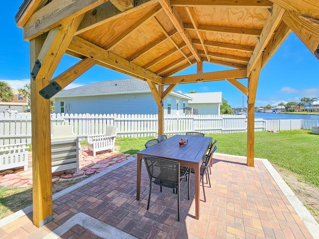 364 Palm Cir, Flagler Beach, FL 32136 - view of patio / terrace with a water view, a gazebo, a fenced backyard, and outdoor dining space