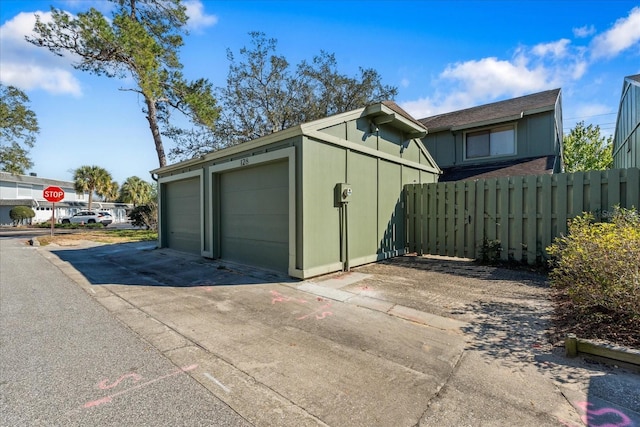 garage with fence