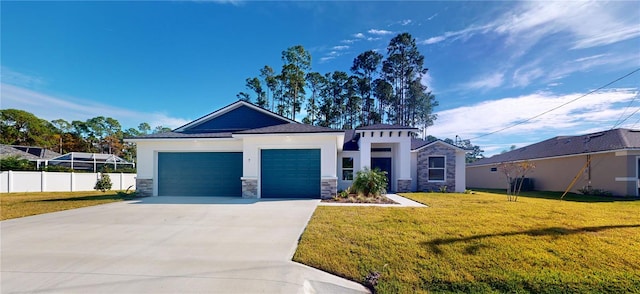 view of front facade with a garage, fence, stone siding, concrete driveway, and a front lawn