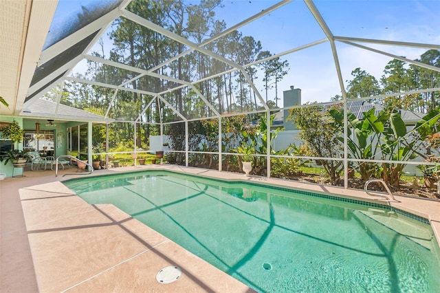 33 Poinsettia Ln, Palm Coast, FL 32164 - swimming pool featuring a patio, a lanai, and a ceiling fan