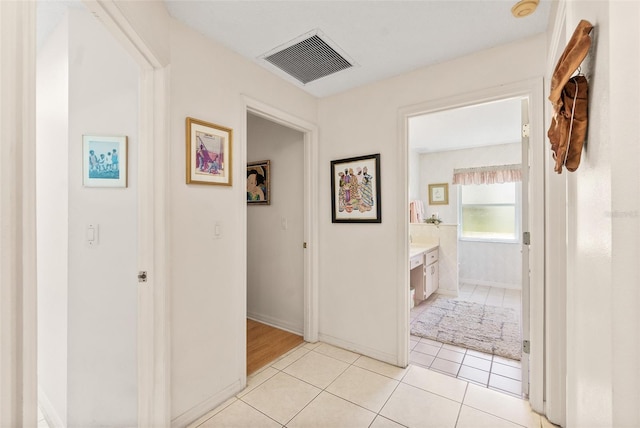 33 Poinsettia Ln, Palm Coast, FL 32164 - corridor with light tile patterned floors and baseboards