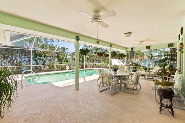 33 Poinsettia Ln, Palm Coast, FL 32164 - swimming pool featuring ceiling fan, a patio, glass enclosure, and a fenced backyard