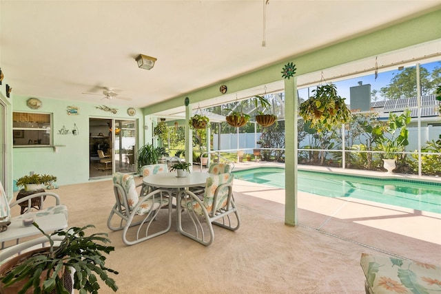 33 Poinsettia Ln, Palm Coast, FL 32164 - view of swimming pool with a patio area, a ceiling fan, and a lanai