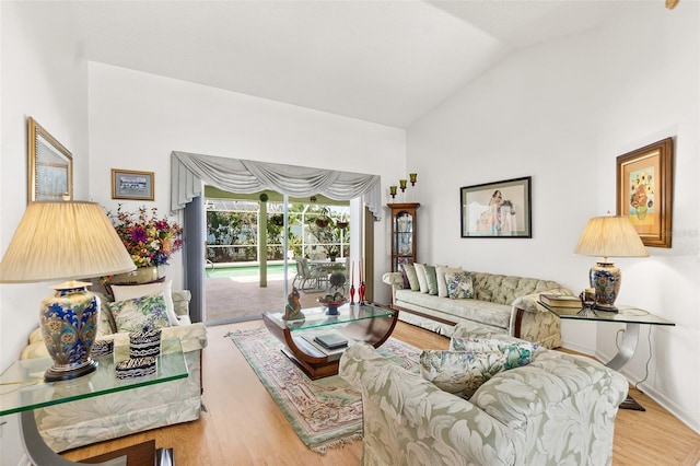 33 Poinsettia Ln, Palm Coast, FL 32164 - living room with vaulted ceiling and wood finished floors
