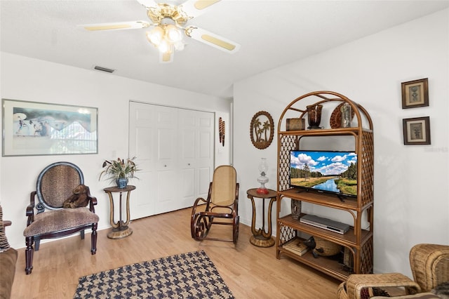 33 Poinsettia Ln, Palm Coast, FL 32164 - sitting room featuring light wood finished floors and ceiling fan
